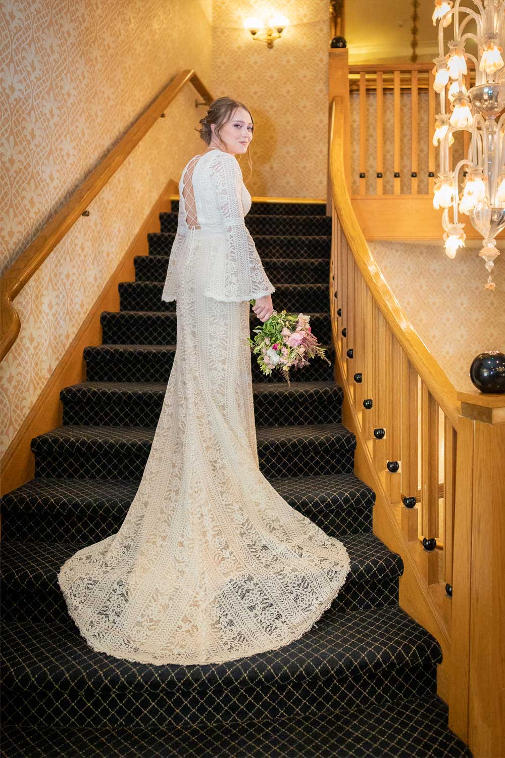 Bride on stairs at the Grand Hotel, Torquay