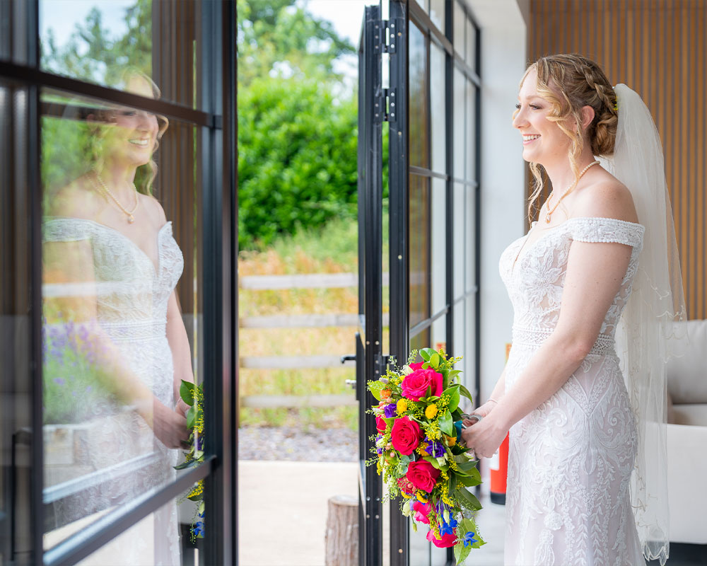 Bride and her reflection at Upton Barn.