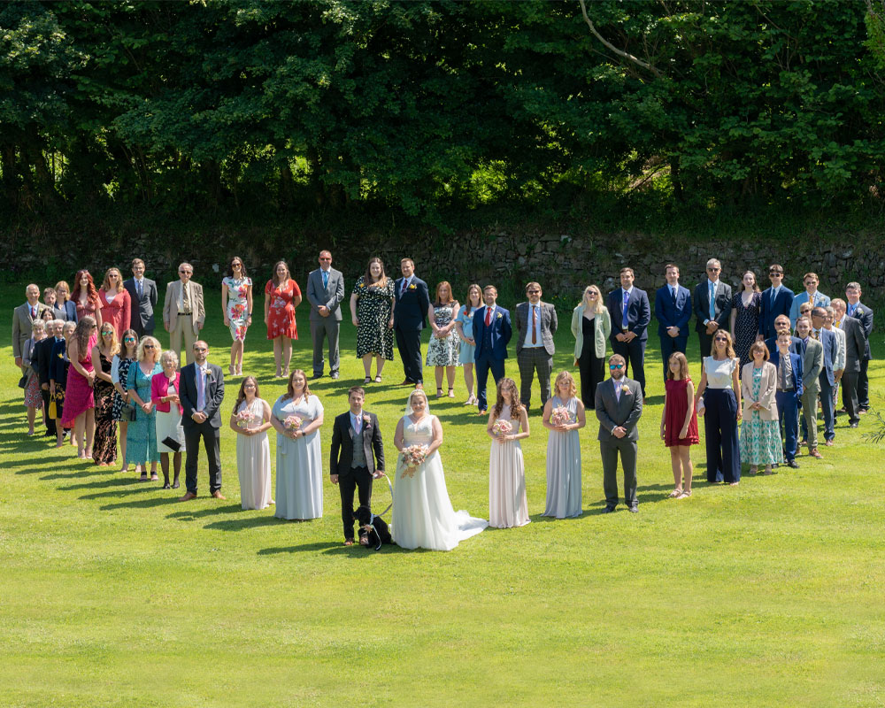 Wedding group shot in heart shape, Kingsteignton, Devon..