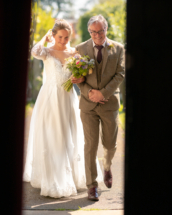 Bride and Father of the bride, through the church doors