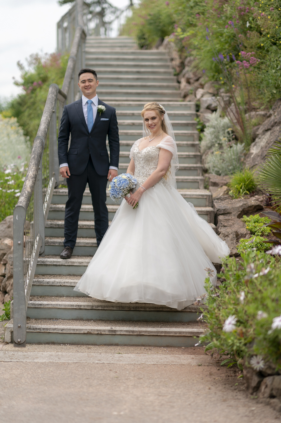 Bride and Groom on stairs at Rock walk in Torquay, Devon.
