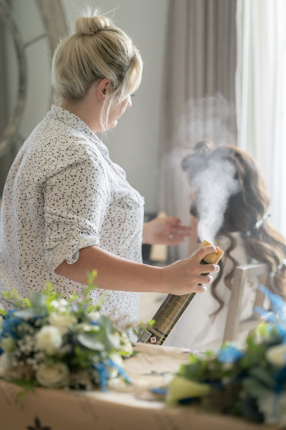 Bride and hair spray