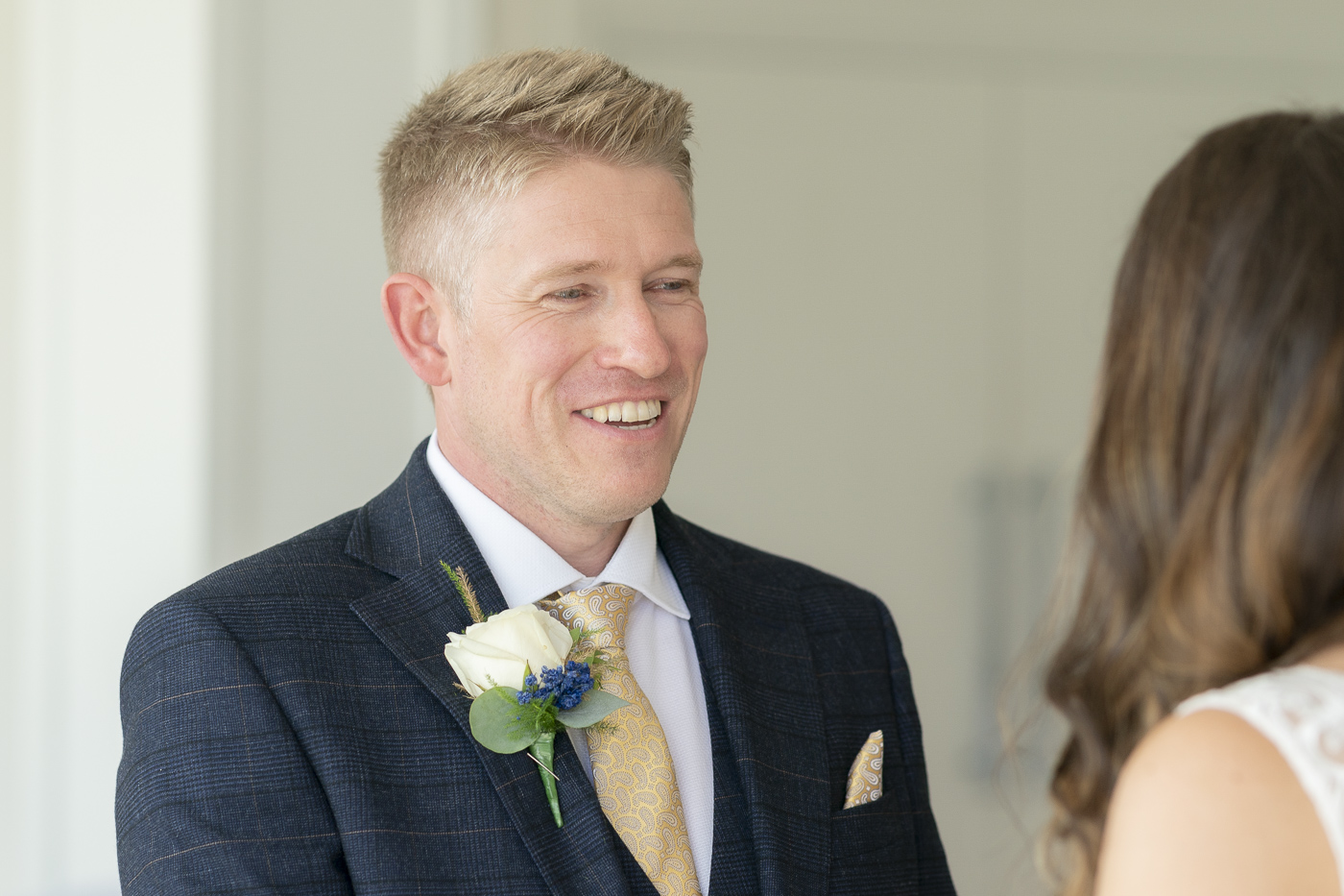 Groom smiling with emotion